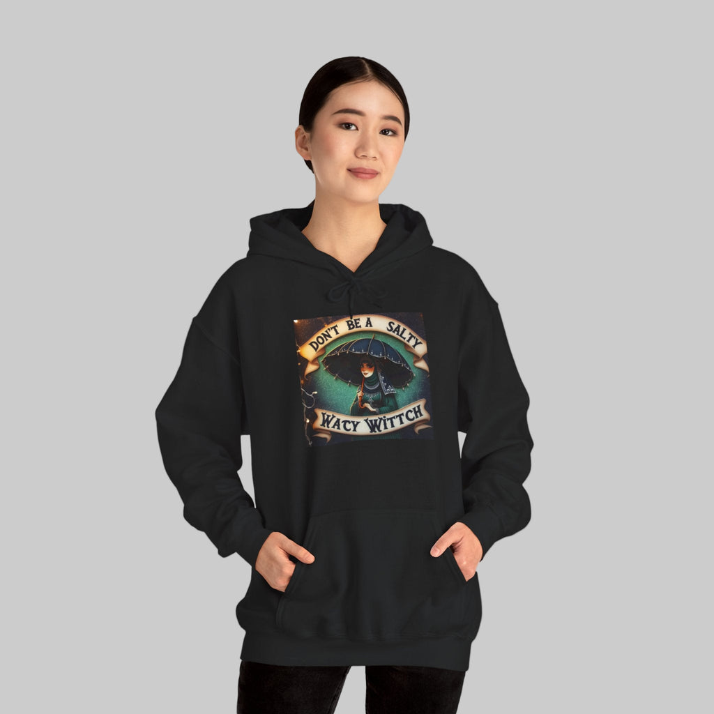 Witch a black hoodie with a graphic design 