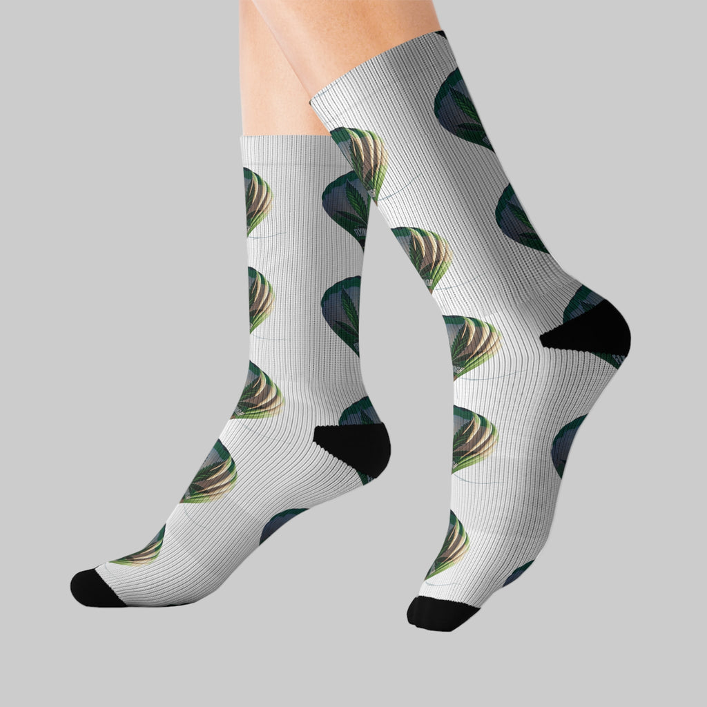 Weed socks with avocado pattern worn by a person on a white background